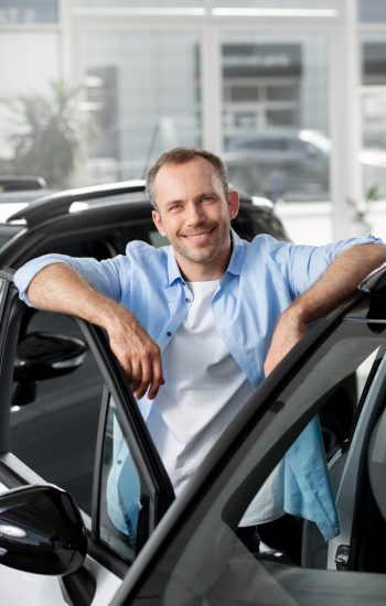 close-up-customer-with-business-person-car-dealership